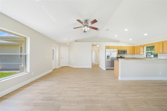 11615 SW Pine Ave, Arcadia, FL 34269 - kitchen featuring stainless steel appliances, a sink, a ceiling fan, lofted ceiling, and light wood finished floors