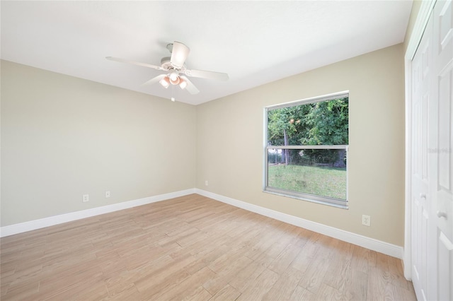 11615 SW Pine Ave, Arcadia, FL 34269 - spare room with light wood finished floors, a ceiling fan, and baseboards