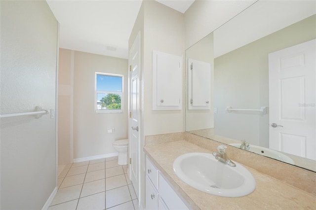11615 SW Pine Ave, Arcadia, FL 34269 - bathroom featuring vanity, toilet, tile patterned flooring, and baseboards