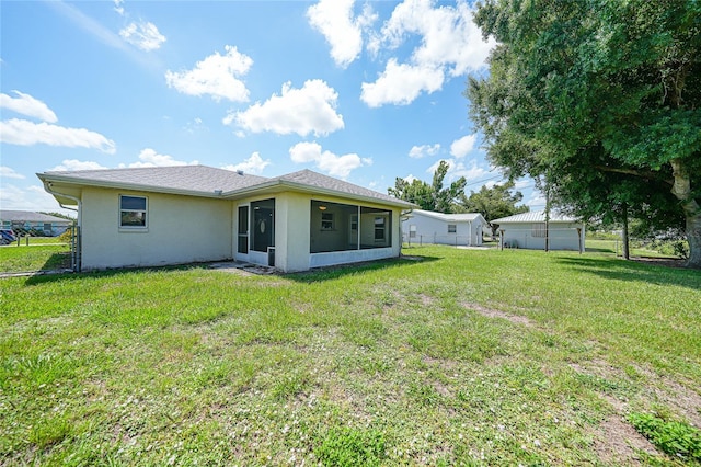 11615 SW Pine Ave, Arcadia, FL 34269 - back of property with a sunroom and stucco siding