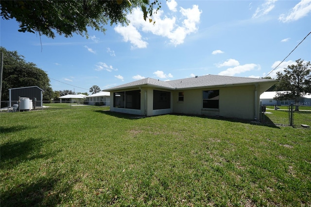 11615 SW Pine Ave, Arcadia, FL 34269 - rear view of house with a sunroom and stucco siding
