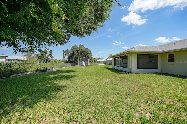 11615 SW Pine Ave, Arcadia, FL 34269 - view of yard featuring a sunroom and a storage shed