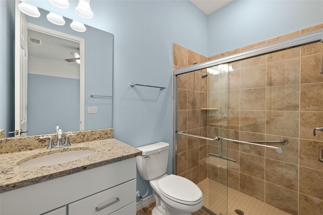 43406 Boardwalk Loop, Punta Gorda, FL 33982 - bathroom featuring vanity, toilet, and a stall shower