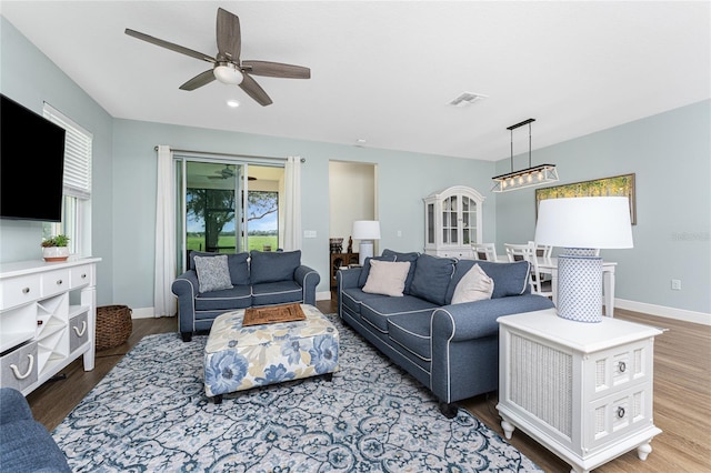 8866 Tuscany Isles Dr, Punta Gorda, FL 33950 - living area with plenty of natural light, a ceiling fan, wood finished floors, baseboards, and recessed lighting