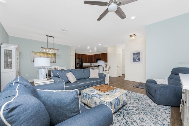 8866 Tuscany Isles Dr, Punta Gorda, FL 33950 - living room featuring dark wood-style flooring, ceiling fan, baseboards, and recessed lighting