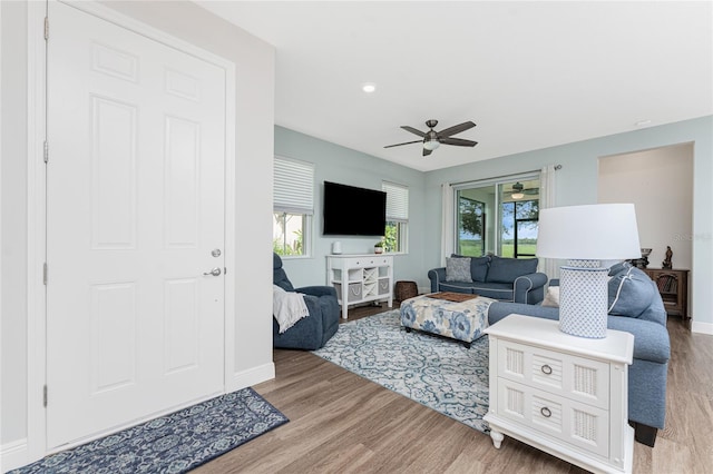 8866 Tuscany Isles Dr, Punta Gorda, FL 33950 - living room featuring ceiling fan, wood finished floors, and baseboards