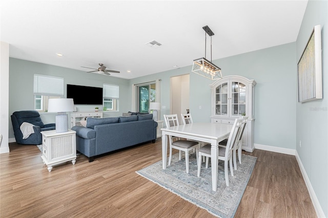 8866 Tuscany Isles Dr, Punta Gorda, FL 33950 - dining area featuring light wood-style flooring, baseboards, ceiling fan, and recessed lighting
