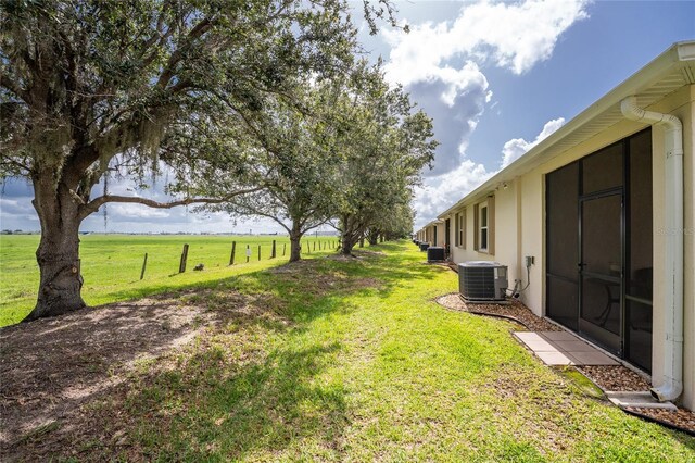 8866 Tuscany Isles Dr, Punta Gorda, FL 33950 - view of grassy yard featuring central air condition unit