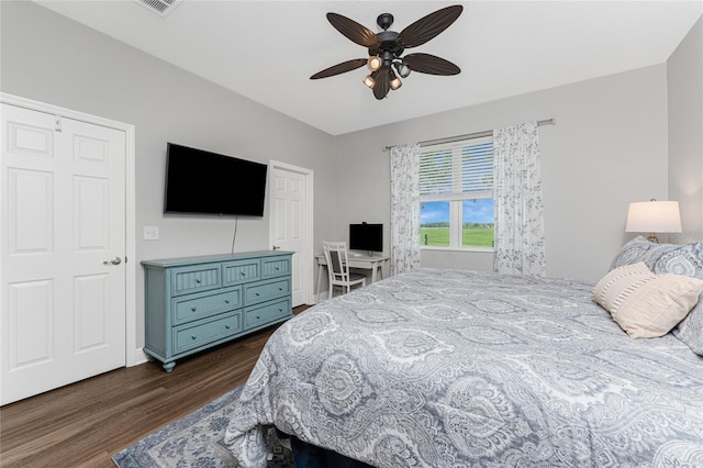 8866 Tuscany Isles Dr, Punta Gorda, FL 33950 - bedroom with dark wood-type flooring, a ceiling fan, and baseboards