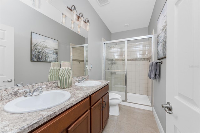 8866 Tuscany Isles Dr, Punta Gorda, FL 33950 - bathroom with toilet, tile patterned floors, double vanity, a shower stall, and baseboards