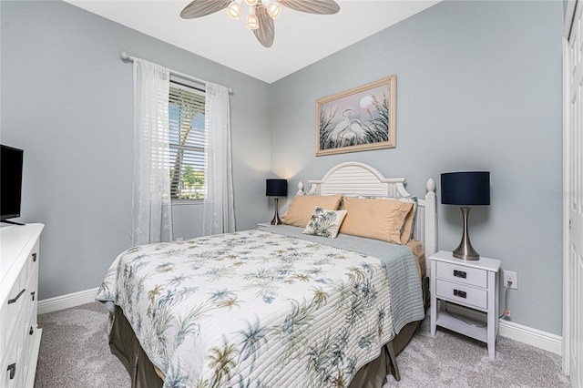 8866 Tuscany Isles Dr, Punta Gorda, FL 33950 - bedroom with light colored carpet, baseboards, and ceiling fan