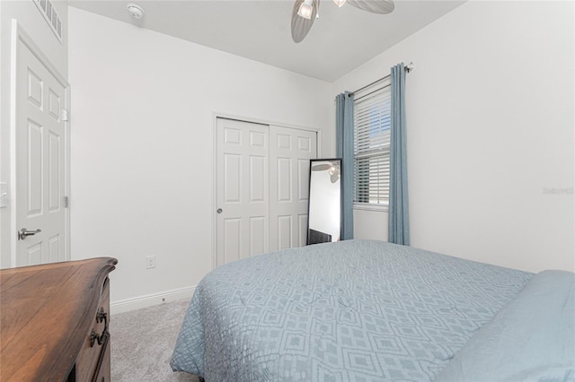 8866 Tuscany Isles Dr, Punta Gorda, FL 33950 - bedroom featuring carpet flooring, a closet, baseboards, and ceiling fan