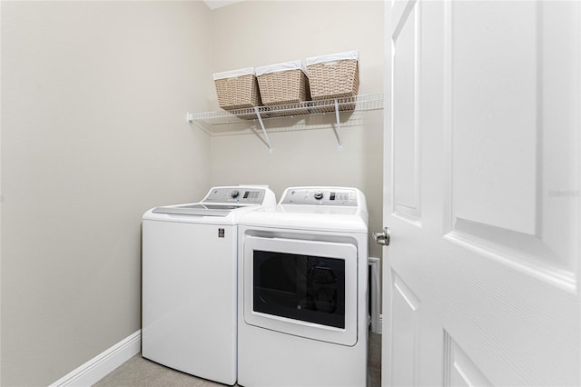 8866 Tuscany Isles Dr, Punta Gorda, FL 33950 - washroom featuring washer and clothes dryer and baseboards