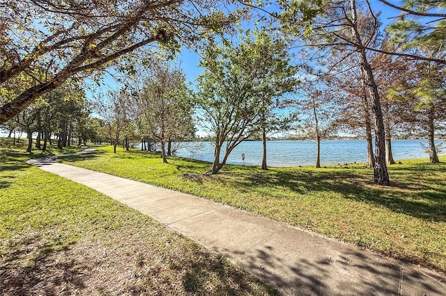 8866 Tuscany Isles Dr, Punta Gorda, FL 33950 - view of home's community with a water view and a lawn
