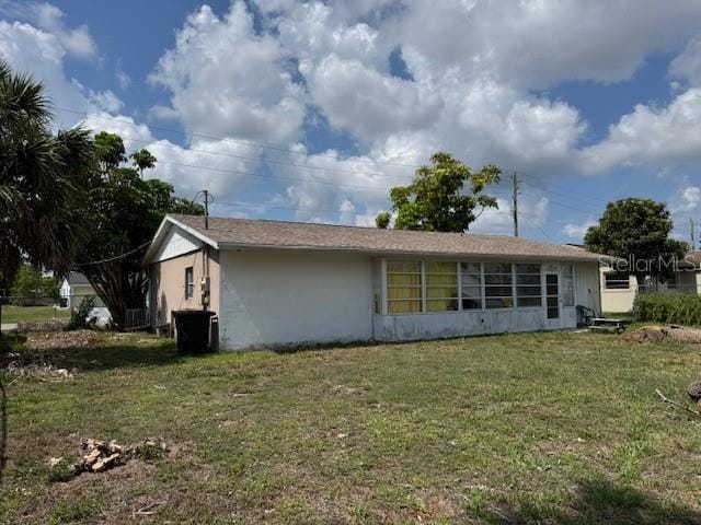 8158 Trionfo Ave, North Port, FL 34287 - view of front of home featuring a front lawn and stucco siding