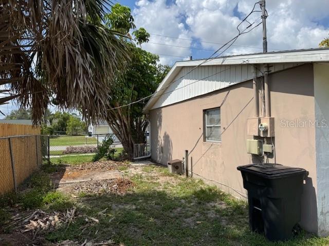 8158 Trionfo Ave, North Port, FL 34287 - view of side of home with stucco siding