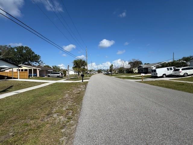 8158 Trionfo Ave, North Port, FL 34287 - view of asphalt street featuring a residential view