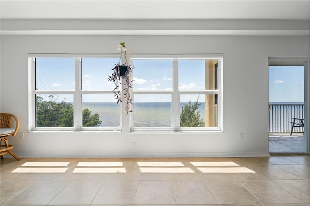101 N Marion Ct Unit 133, Punta Gorda, FL 33950 - spare room featuring baseboards, tile patterned floors, and a water view