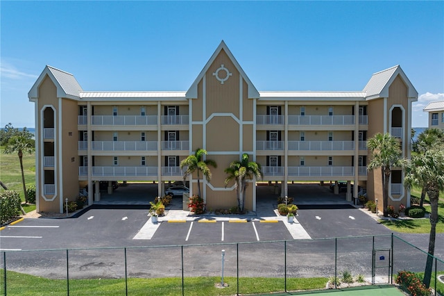 101 N Marion Ct Unit 133, Punta Gorda, FL 33950 - view of apartment building / complex featuring covered and uncovered parking