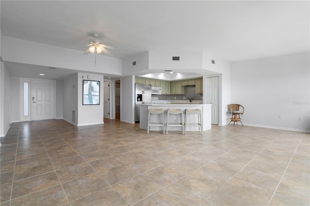 101 N Marion Ct Unit 133, Punta Gorda, FL 33950 - unfurnished living room featuring ceiling fan, light tile patterned floors, a sink, and baseboards