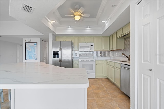 101 N Marion Ct Unit 133, Punta Gorda, FL 33950 - kitchen featuring appliances with stainless steel finishes, ornamental molding, ceiling fan, tasteful backsplash, and a sink