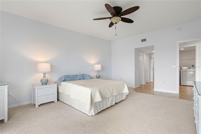 101 N Marion Ct Unit 133, Punta Gorda, FL 33950 - carpeted bedroom featuring washer / clothes dryer, baseboards, and a ceiling fan
