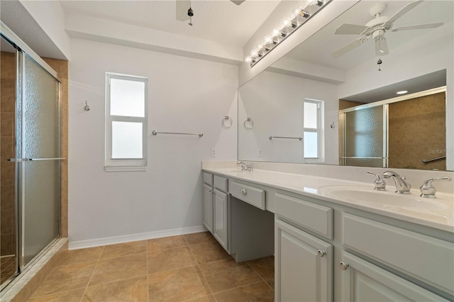 101 N Marion Ct Unit 133, Punta Gorda, FL 33950 - bathroom featuring a shower stall, double vanity, a ceiling fan, and baseboards
