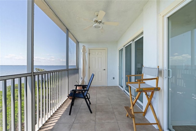 101 N Marion Ct Unit 133, Punta Gorda, FL 33950 - sunroom / solarium with ceiling fan, a water view, and a textured ceiling