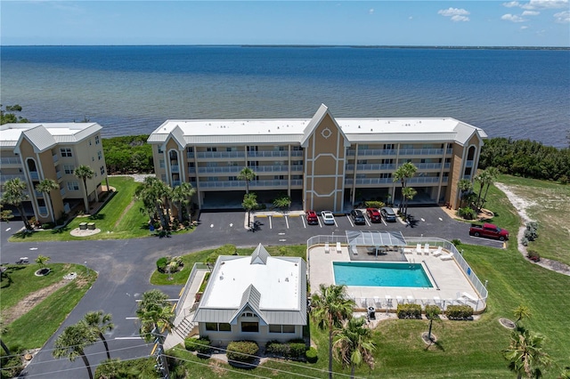 101 N Marion Ct Unit 133, Punta Gorda, FL 33950 - drone / aerial view of a pool area, a nearby body of water, and apartment complex / building