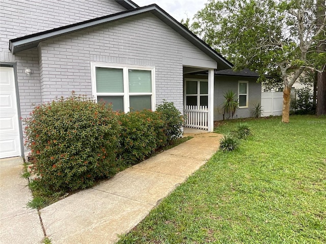 41 Brewster Ln, Palm Coast, FL 32137 - view of side of property featuring brick siding