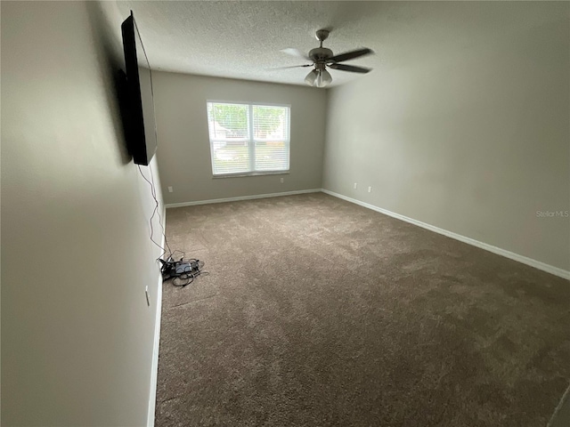 41 Brewster Ln, Palm Coast, FL 32137 - empty room with carpet floors, a ceiling fan, baseboards, and a textured ceiling