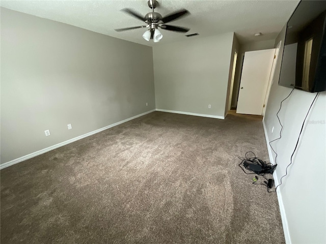 41 Brewster Ln, Palm Coast, FL 32137 - carpeted empty room with ceiling fan, baseboards, and a textured ceiling