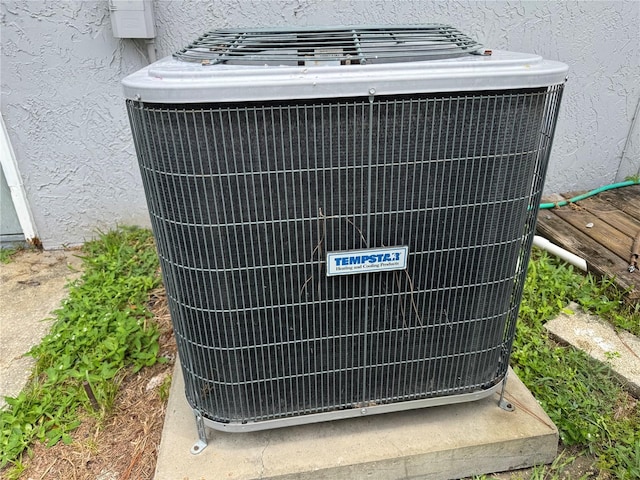 41 Brewster Ln, Palm Coast, FL 32137 - exterior view of cooling unit and stucco siding