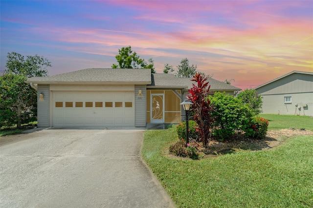 541 Wekiva River Ct Unit 94, Englewood, FL 34223 - ranch-style home featuring concrete driveway, an attached garage, and a lawn