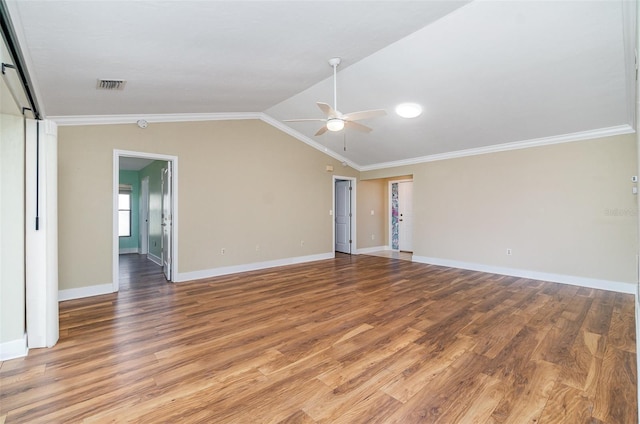 541 Wekiva River Ct Unit 94, Englewood, FL 34223 - empty room with a ceiling fan, wood finished floors, ornamental molding, lofted ceiling, and baseboards