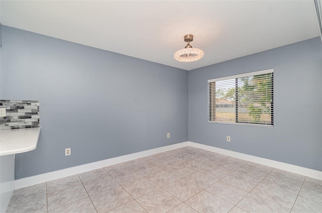 541 Wekiva River Ct Unit 94, Englewood, FL 34223 - empty room featuring baseboards and light tile patterned floors