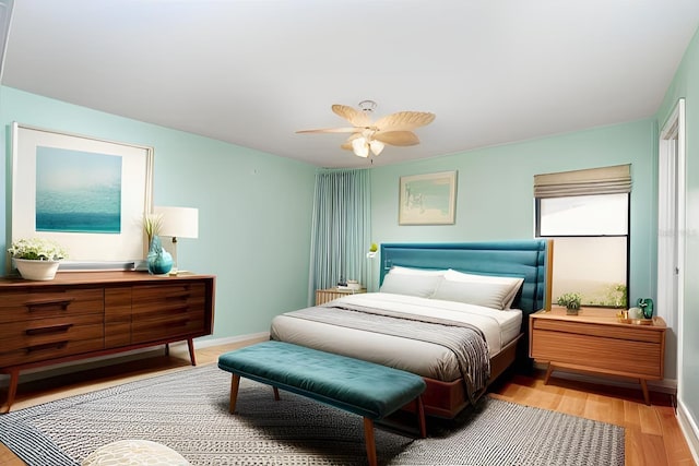 541 Wekiva River Ct Unit 94, Englewood, FL 34223 - bedroom featuring light wood-style flooring, baseboards, and a ceiling fan
