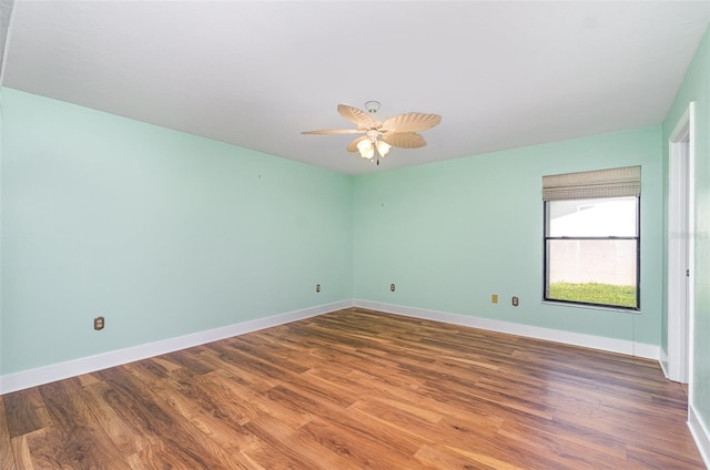 541 Wekiva River Ct Unit 94, Englewood, FL 34223 - spare room featuring wood finished floors, baseboards, and ceiling fan