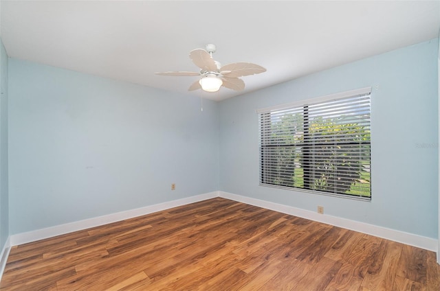 541 Wekiva River Ct Unit 94, Englewood, FL 34223 - spare room featuring wood finished floors, baseboards, and a ceiling fan