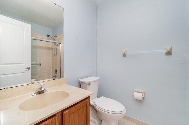541 Wekiva River Ct Unit 94, Englewood, FL 34223 - full bath featuring tile patterned floors, a shower with shower door, vanity, toilet, and baseboards
