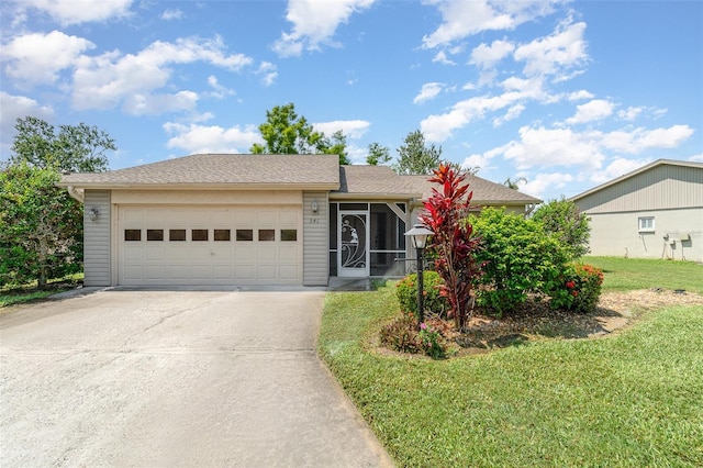 541 Wekiva River Ct Unit 94, Englewood, FL 34223 - ranch-style house with concrete driveway, an attached garage, and a front lawn