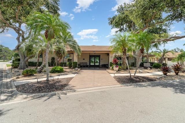 541 Wekiva River Ct Unit 94, Englewood, FL 34223 - view of front of house featuring stucco siding and french doors
