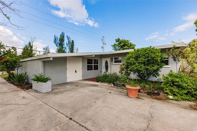 3129 Buttonwood Pl, Punta Gorda, FL 33950 - view of front of home with stucco siding and a patio area
