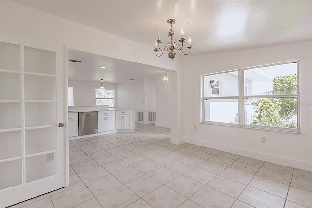 3129 Buttonwood Pl, Punta Gorda, FL 33950 - unfurnished living room featuring light tile patterned flooring, a chandelier, and baseboards
