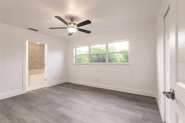 3129 Buttonwood Pl, Punta Gorda, FL 33950 - empty room featuring wood finished floors, baseboards, and ceiling fan