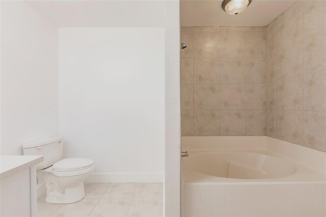 3129 Buttonwood Pl, Punta Gorda, FL 33950 - full bath with tiled bath, vanity, toilet, tile patterned floors, and baseboards