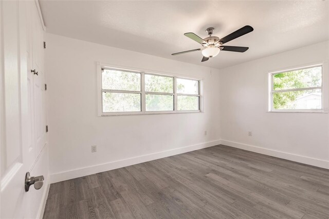 3129 Buttonwood Pl, Punta Gorda, FL 33950 - unfurnished room with healthy amount of natural light, dark wood-type flooring, baseboards, and a ceiling fan