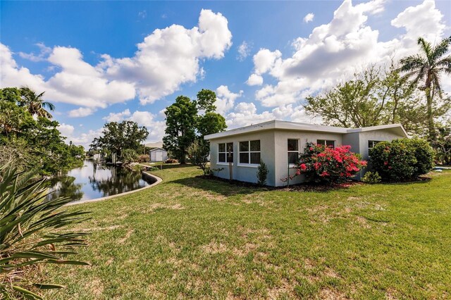 3129 Buttonwood Pl, Punta Gorda, FL 33950 - view of green lawn featuring a water view