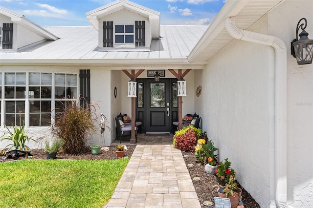 425 Corrientes Cir, Punta Gorda, FL 33983 - property entrance featuring stucco siding and a porch