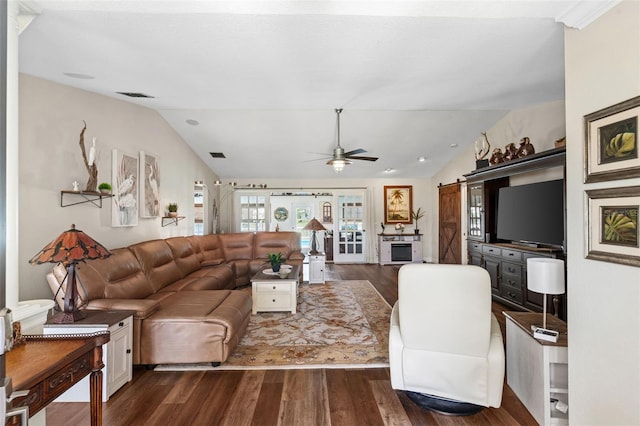 425 Corrientes Cir, Punta Gorda, FL 33983 - living area featuring lofted ceiling, dark wood-style floors, ceiling fan, and a barn door